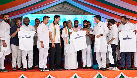 Congress leaders releases I am a cockroach t-shirt in Bengaluru