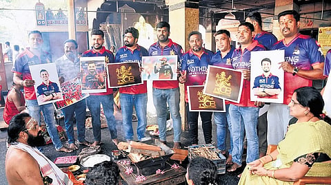 RCB fans perform a special pooja and homa at the Amruteshwara Swamy temple in Mysuru on Saturday.