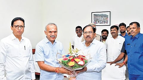 BJP MLAs B Suresh Gowda and G B Jyothiganesh greet DCM Dr G Parameshwara in Tumakuru on Sunday.