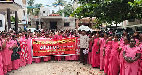 ASHA workers stage a protest demanding their due incentive in Hosapete on Monday.