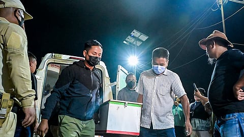 Bodies being brought at JNIMS mortuary, in Imphal, Manipur, early Thursday.