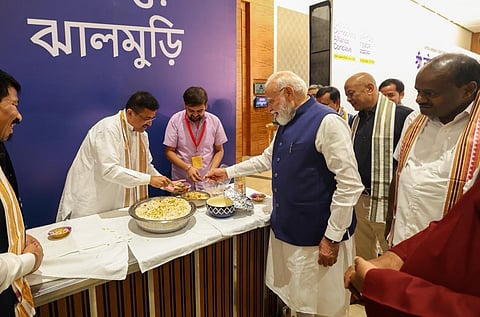 Suvendu Adhikari gives snacks to PM Narendra Modi 