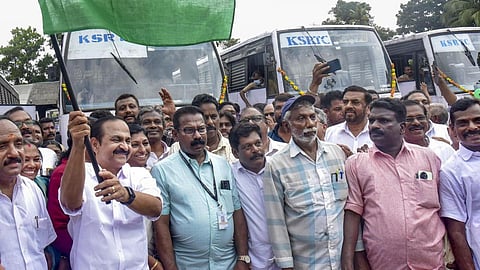 Keralam CM VD Satheesan flags off a bus under the 'Priyadarshini Scheme