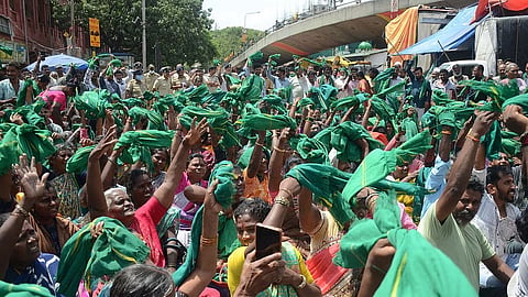 Members of the Karnataka Rajya Raitha Sangha and Green Brigade protest at City Market on Tuesday.
