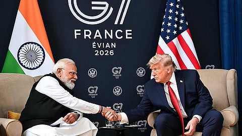 US President Donald Trump (R) shakes hands with India's Prime Minister Narendra Modi during a bilateral meeting in France