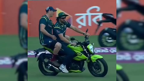 Tim David rides a bike after Australia beat Bangladesh.