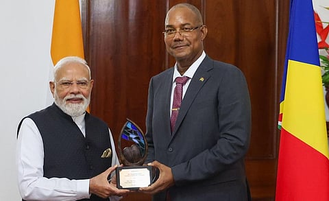  Prime Minister Narendra Modi receives the 'Guardian of the Blue Horizon' from Seychelles President Patrick Herminie, in Seychelles
