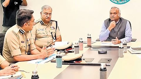 Home Minister Priyank Kharge chairs a meeting with traffic police officials on Monday.