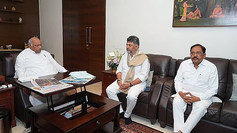 Chief Minister DK Shivakumar in conversation with AICC president Mallikarjun Kharge in Bengaluru on Saturday. Deputy CM Dr G Parameshwara was also present.