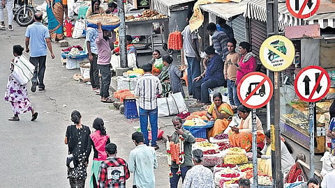 Even after the footpath on Avenue Road was cleared, street vendors have resumed their business, leaving no space for pedestrians on Monday 