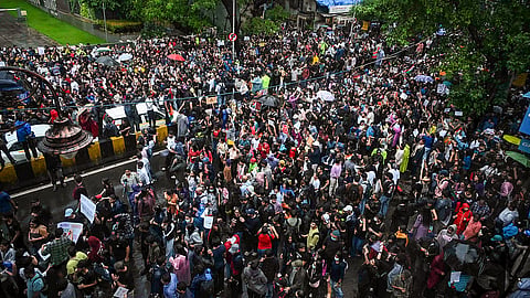 Protestors gather in support of CJP and demand Education Minister Dharmendra Pradhan's resignation in Mumbai.