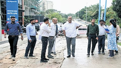 M Maheshwar Rao inspects white topping of a road in Bengaluru North City Corporation limits on Friday 
