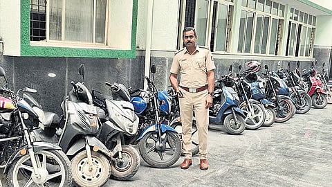 Two-wheelers seized in a crackdown on illegal bike taxi operations parked at a police station in Bengaluru on Wednesday