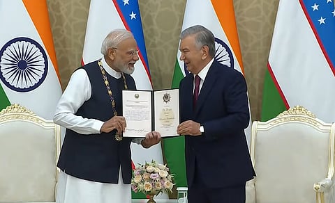 Prime Minister Narendra Modi being conferred with Uzbekistan's prestigious 'Oliy Darajali Do'stlik' by Uzbekistan President Shavkat Mirziyoyev
