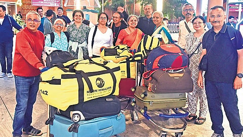 Karnataka trekkers arrived safely after being stranded in Nepal due to the deadly flash floods at KIA, Bengaluru, on Tuesday. 