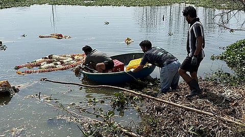 Volunteers at work removing festival waste
