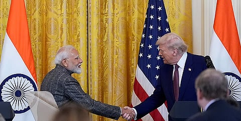 US President Donald Trump and Prime Minister Narendra Modi shake hands during a news conference in the East Room of the White House, in Washington.
