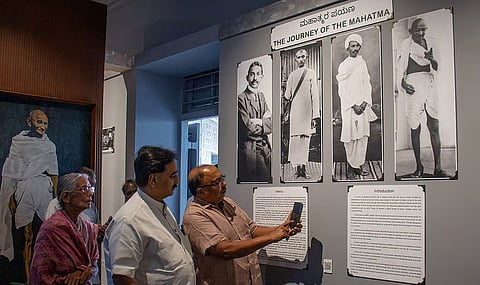 Gandhi Bhavan president Wooday P Krishna and treasurer Dinesh HB shows 