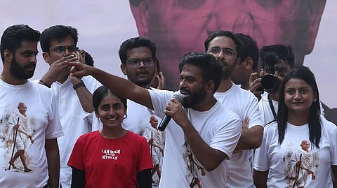 Abhijeet Dipke, head of the Cockroach Janta Party (CJP) addresses his supporters during a protest