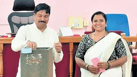 Minister Rudrappa Lamani (left) with the woman accused of casting a bogus vote in Haveri on Saturday