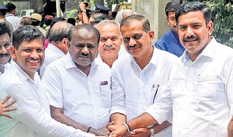 NDA candidates AP Ranganath (left) and KM Suresh (second from right) greet Union Minister HD Kumaraswamy and state BJP chief BY Vijayendra