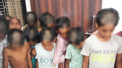 மாணவர்களுக்கு பாதி மொட்டை
