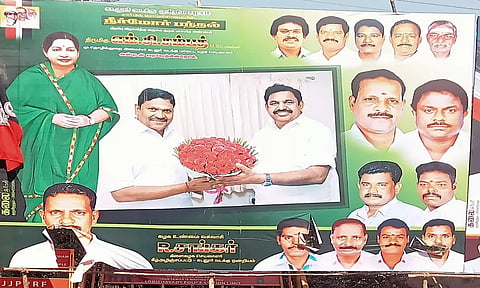 கிழிக்கப்பட்ட அ.தி.மு.க. பேனர்.
