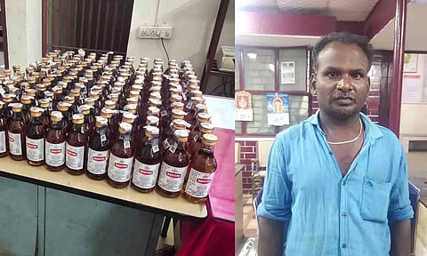 கைதானவரையும் பறிமுதல் செய்யப்பட்ட மதுபாட்டில்களையும் படத்தில் காணலாம்.&nbsp;