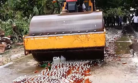 திருப்பதியில் மது பாட்டில்கள் அழிப்பு