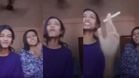 സിഗരറ്റ് വലിച്ചുകൊണ്ട് ദേശീയഗാനത്തേയും പതാകയേയും അവഹേളിച്ച് പെൺകുട്ടികൾ; വിവാദമായി വീഡിയോ