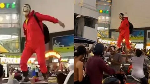 man dressed in a 'Money Heist' costume showered money on the streets of Jaipur