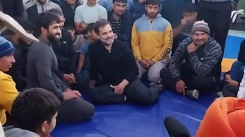 Rahul Gandhi talks to Barrang Punia and other wrestlers at a Haryana Akhara on Wednesday.