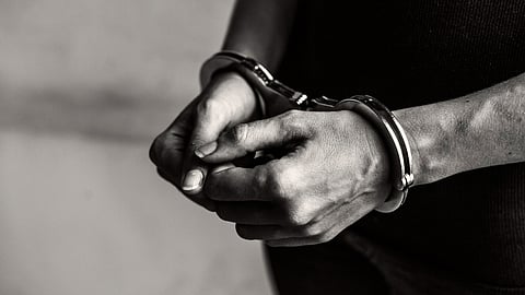 Representative image for an accused in a hand cuff.