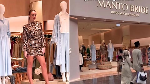 Female model stands on display at clothing store in Dubai mall viral video
