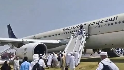 saudi airlines with 297 aboard catches fire emergency landing at peshawar airport 