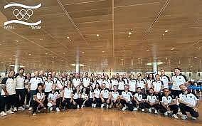 Members of Israel's delegation to the Paris 2024 Olympic and Paralympic Games pose for a group picture ahead of departure, at Ben Gurion airport near Tel Aviv on July 22, 2024. (Jorge Novominsky / AFP)