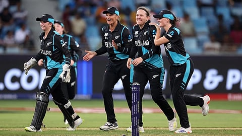 New Zealand players celebrate an Indian wicket
