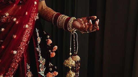 Bride takes money from wedding guests