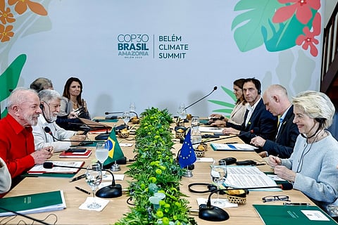 This handout picture released by the Brazilian Presidency shows Brazil's President Luiz Inacio Lula da Silva and the President of the European Union Ursula von der Leyen shaking talking during a meeting in Belem, Para State, Brazil on November 5, 2025

