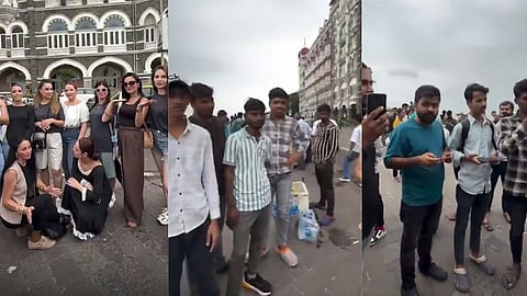 foreign women posing-near mumbais gateway of india