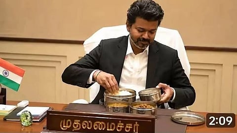 Vijay arrives at the office with lunch; punctuality remains unwavering