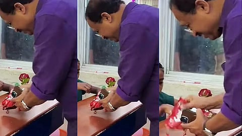 v muraleedharan criticized on social media over manner of distributing sweets
