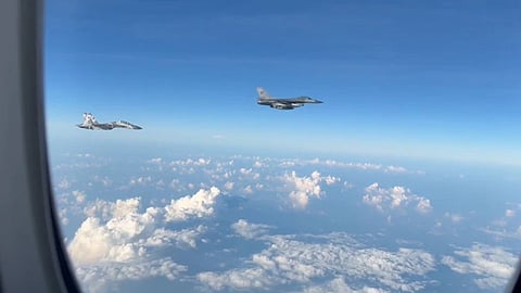 Indonesian F-16 and Sukhoi-30 fighter jets flying as an escort to Prime Minister Narendra Modi's aircraft