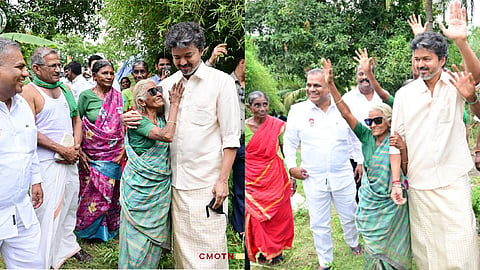 Chellam, an elderly woman wearing sunglasses, standing with Chief Minister Vijay.