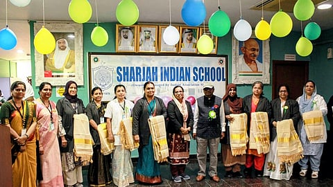 Teachers who have completed 25 years of service are honored on Teachers' Day