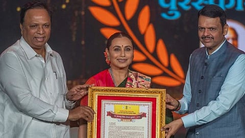 Chief Minister Devendra Fadnavis presents the Raj Kapoor Special Contribution Award to Bollywood actress Rani Mukerji at the 62nd Maharashtra State Film Awards ceremony.