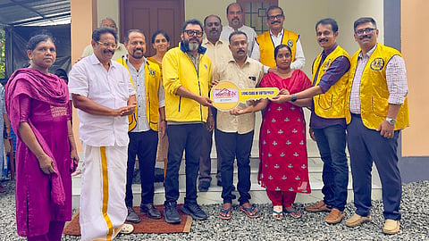 District Governor Shine Kumar hands over the key to a house built for Roychan Joseph of Nadodippalam, Chelad—one of nine homes completed by the Lions Club of Kottappadi in collaboration with the Chittilappilly Foundation. Also present are President Sijo Jacob, U. Roy, Varghese Joseph, George Edappara, Eldos Isaac, Milson George, Manoj Krishnan, Dibl Shoy, and Siji Johnichan.