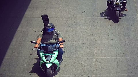 No helmet for the guitar on the back of the scooter; AI camera issues a ₹500 fine