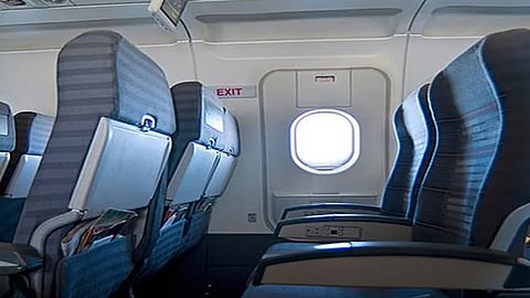 Passenger removed from flight after accidentally grabbing the emergency door handle