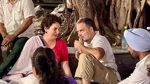Rahul Gandhi and Priyanka Gandhi, seated on the premises of Akashvani Bhavan.